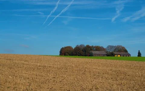 A small farm house with fields in front of it. Foto stock