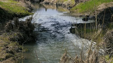 A small fast river flows between the hills Stock Footage 195153057