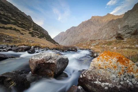 A small fast river high in the mountains. Tien Shan mountain landscape Stock Photos