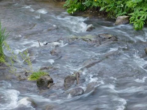 Small but fast river Stock Photos