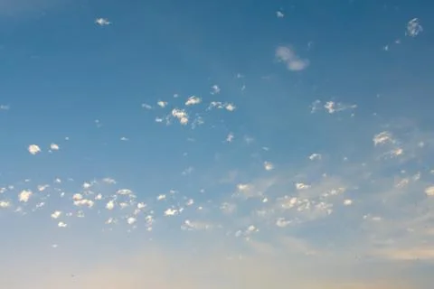 Small feather clouds on the blue sky. Stock Photos