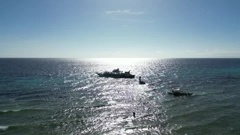 Small Ferry Boat with Sun Behind, Philippines Stock Footage 303280608