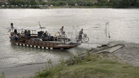 Small ferry that crosses the river Danube Stock Footage 115902177