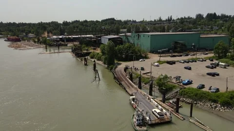 Small ferry crosses river Stock Footage 344900319