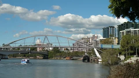 Small ferry heading towards Goodwill Bridge in Brisbane 4K Stock Footage 154562413