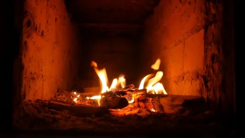 A small fire burns in the fireplace. Сozy and warm. Stock Footage 120750531