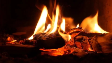 A small fire burns in the fireplace. Сozy and warm. Stock Footage 120750563