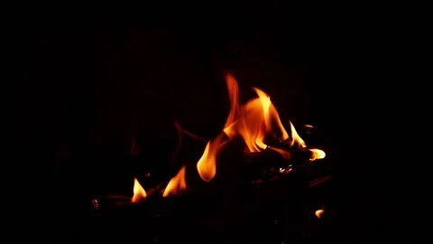 Small fire flames with black background, Shot of fire flames Video stock 148209874