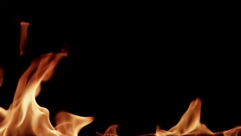 Small fire flames dancing gently against a black background Video stock 329732705