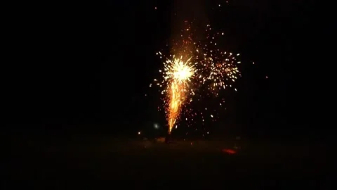 Small firework goes off in a backyard. Stock Footage 138843004