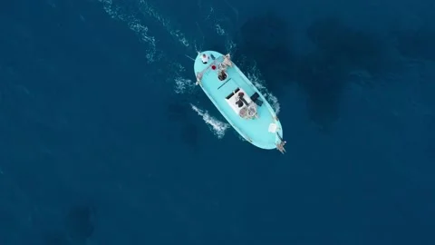Small fish boat rocked by waves in the mediterranean sea, aerial view Stock Footage 168705121