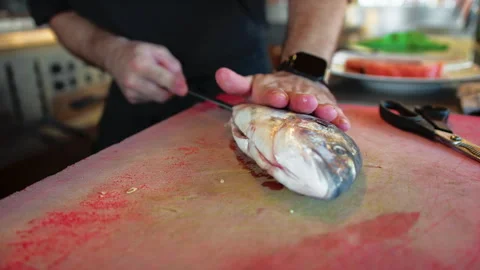 Small Fish Cleaning On The Kitchen Table Stock Footage 283669784