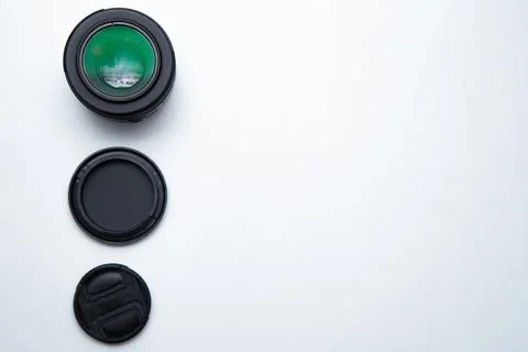 A small fixed lens for a professional camera on a white background with two Foto stock