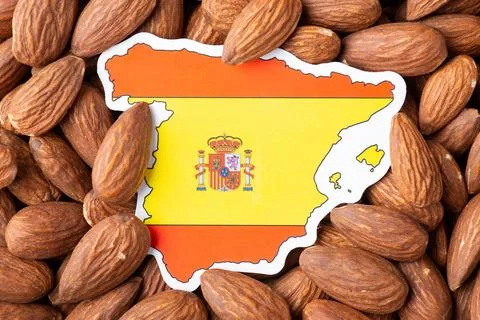 Small flag and map of Spain in almonds Stock Photos