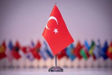 The small flag of Turkey is red with a white star and crescent on the cone. Stock Illustration