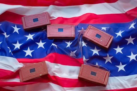 Small flags of America on a colored background. American Independence Day Stock Photos