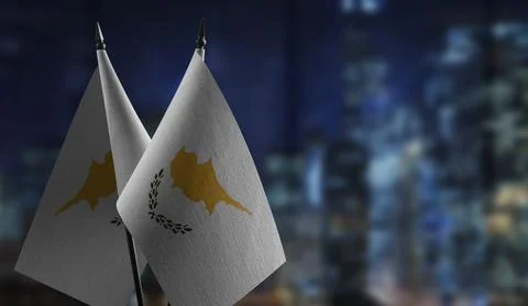 Small flags of the Cyprus on an abstract blurry background Stock Illustration