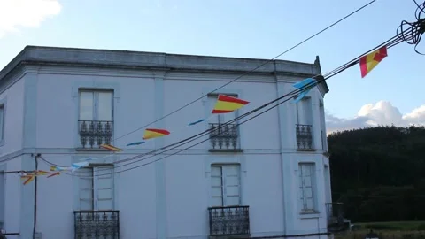 Small flags hang in front of the old house Stock Footage 234023782