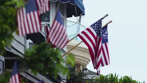 Small flags waving from a house Stock Footage 232075619