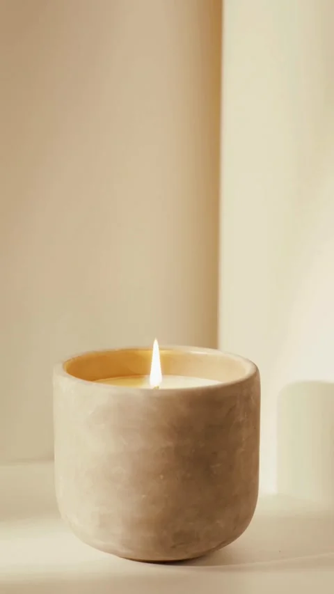 Small flame burning inside a round stone candle holder Stock-Footage 331775326