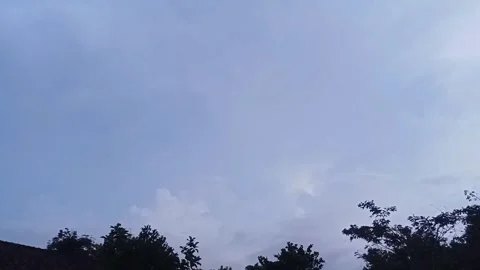 Small flashes of lightning in black clouds Stock Footage 303347852