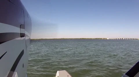 Small float sea plane lands on water Video stock 40770779