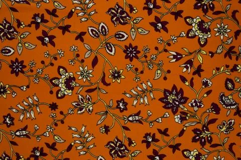 Small floral pattern on fabric. Red, orange and white flowers print as backgr Stock Illustration