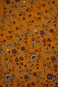 Small floral pattern on fabric. Red, orange and white flowers print as backgr Stock Illustration