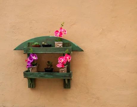 Small flowerpot on a wall Stock Photos