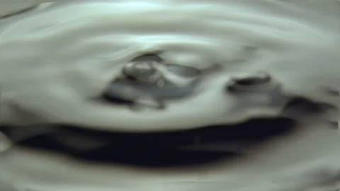 Small fluctuations of water surface from rough drops of rain Stock Footage 235937562