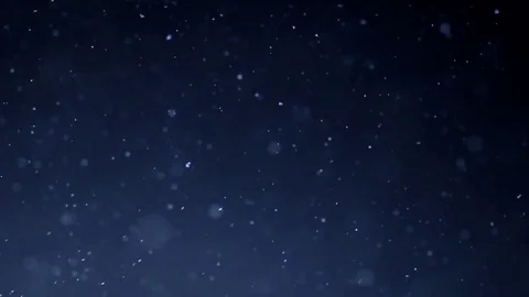 The small flying particles in emptiness. Stock Footage 100799337