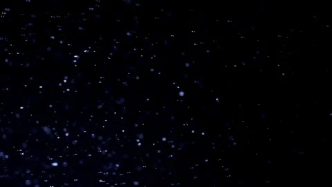 The small flying particles in emptiness. Stock Footage 100799345