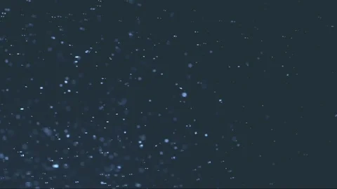 The small flying particles in emptiness. Stock Footage 100799350