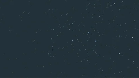 The small flying particles in emptiness. Stock Footage 100799352