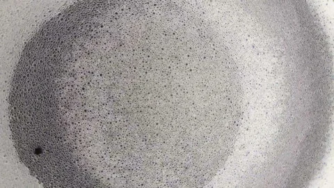 Small foam bubbles rotating , abstract background Video stock 154342332