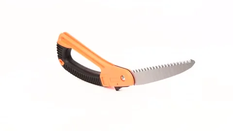 Small fold hand-saw for tree pruning. Folding-saw work tool on white background. Stock Footage 156614449