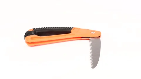 Small fold hand-saw for tree pruning. Folding-saw work tool on white background. Stock Footage 156614477