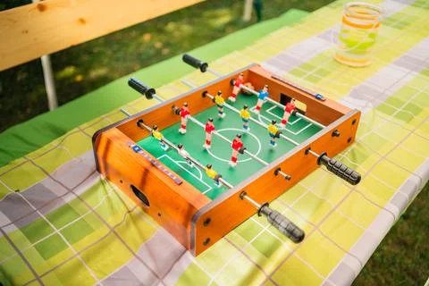 Small Foosball Table Game on a Table in the Sunlight Stock Photos