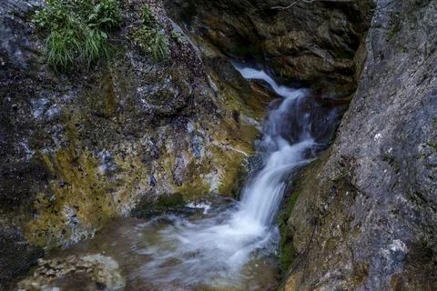 Small forest waterfall flowing between rocks in Mala Fatra, Slovakia Stock Photos