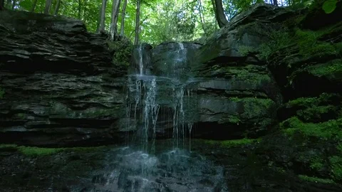 Small forest waterfall, tilt down, slow motion Stock Footage 92644658