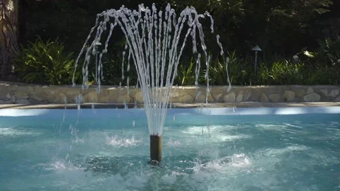 Small fountain in front of a pathway Stock Footage 99158038