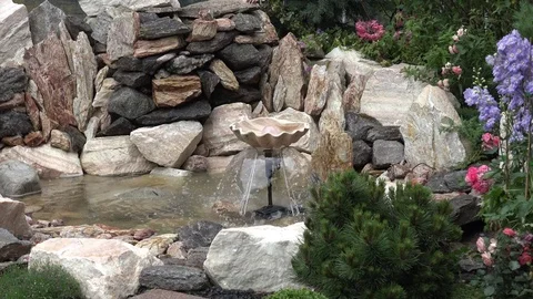 Small fountain in garden Stock Footage 76872791