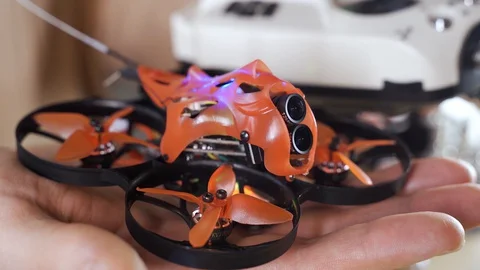 Small FPV Air Drone Takes off From the Palm, Unit Control Equipment, Transmitter Stock Footage 128799561