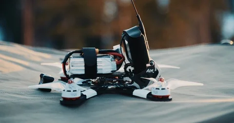 Small FPV UAS drone quadcopter lift off in slow motion Stock Footage 121059314