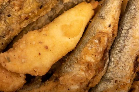 Small fried fish, surface texture, background image, close-up, selective focu Stock Photos