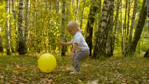 Small funny kid with yellow baloon Video stock 120596826
