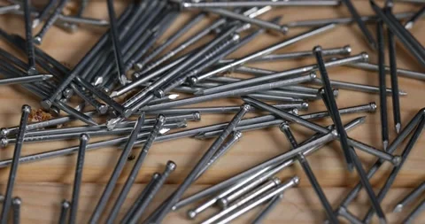 Small galvanized nails for decorative work, nails with small caps for finishing Stock Footage 279878454