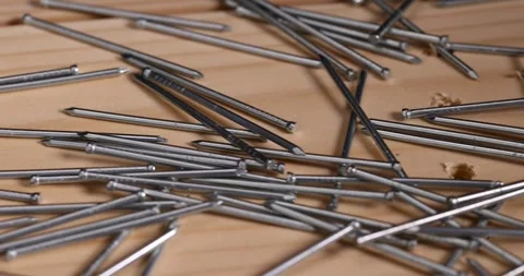 Small galvanized nails for decorative work, nails with small caps for finishing Stock Footage 285582373