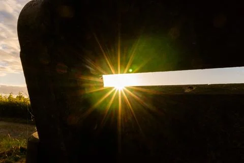 A small gap allows a beam of bright sunlight to stream through Stock Photos