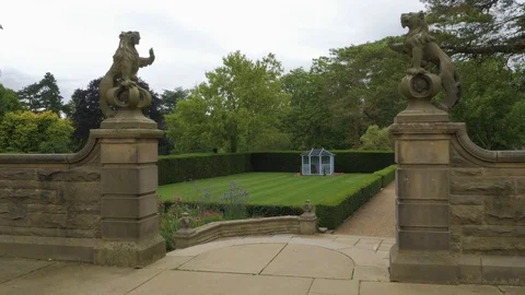 Small garden building at end of immaculate lawn reveal, drone aerial 4K Stock Footage 101132944